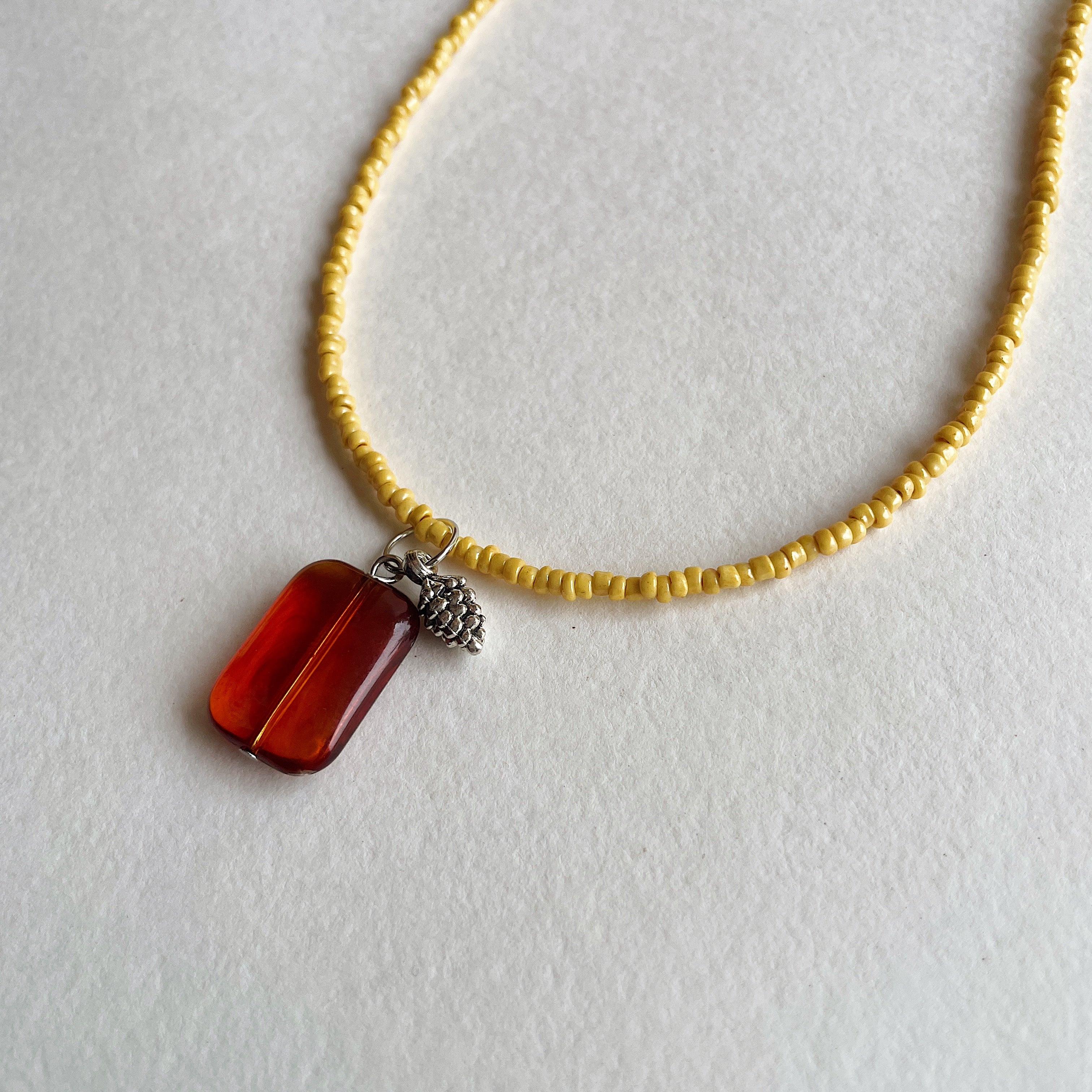 Caramel pine cone pendant necklace ✨
