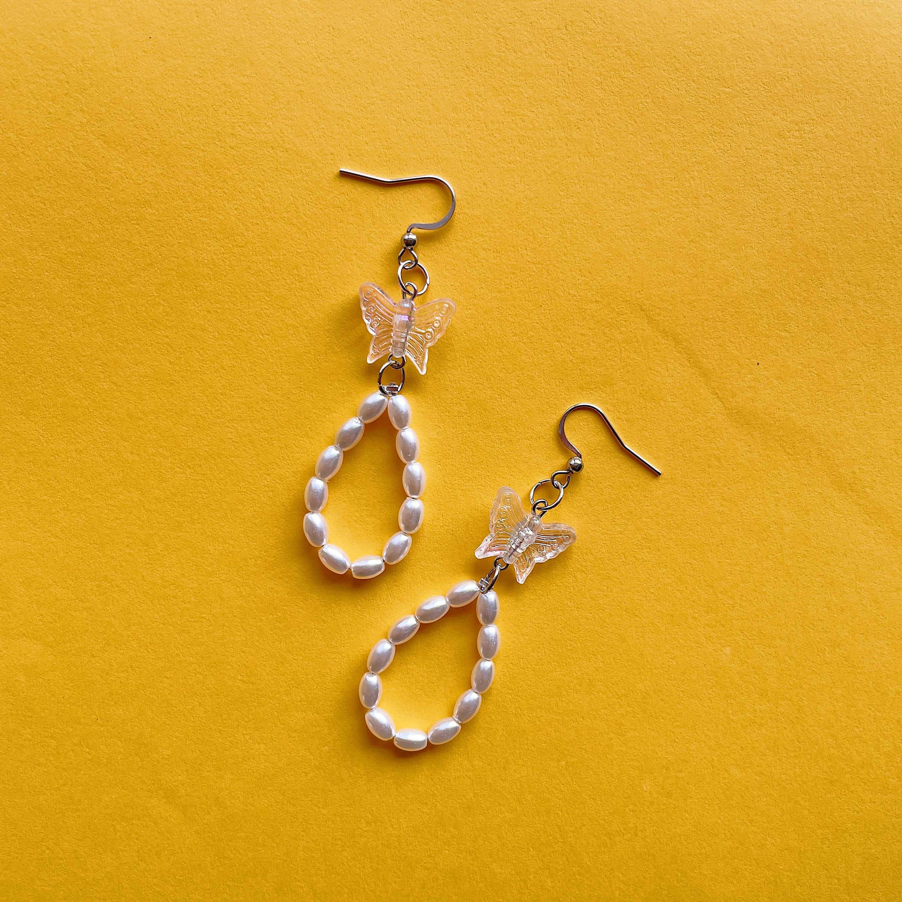 Clear butterfly loop earrings ✨