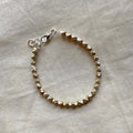 Muted gold and white beaded bracelet ✨