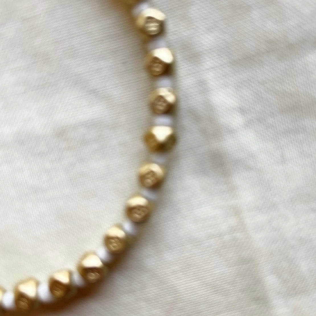 Muted gold and white beaded bracelet ✨