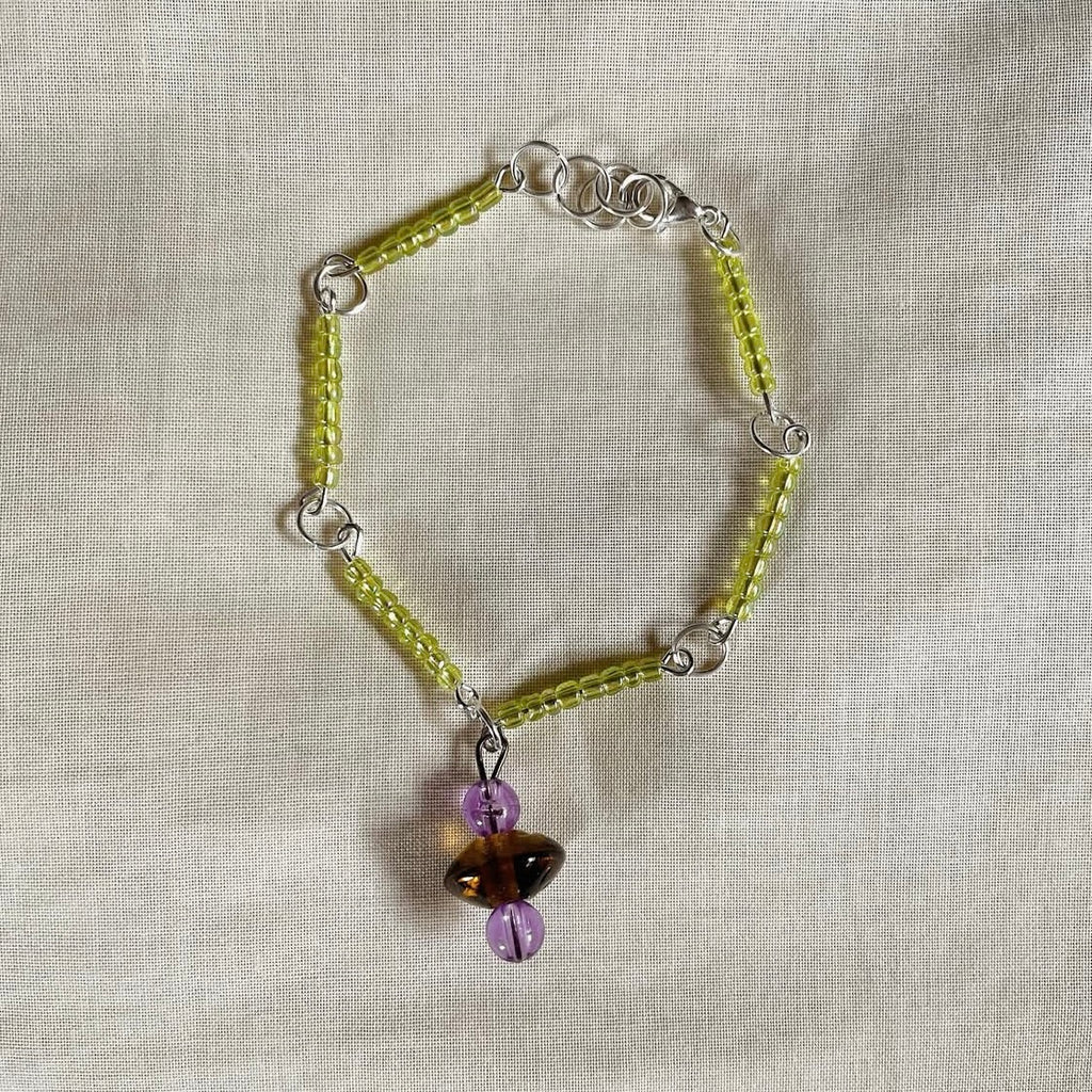 Light green bracelet with charm ✨